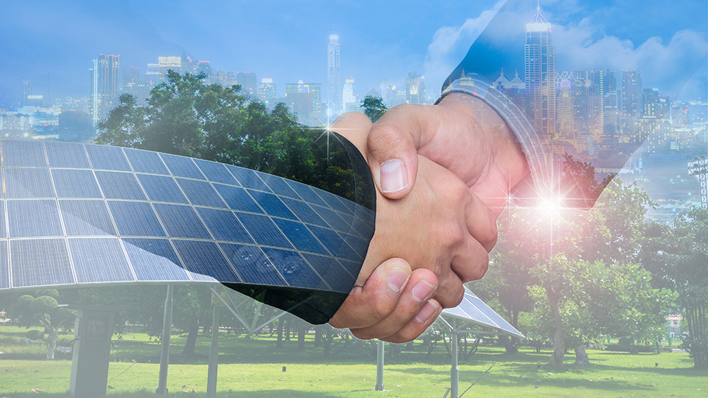 Double Exposure of a businessman handshake on the background blurred downtown nightlife. Concept of an agreement green energy.